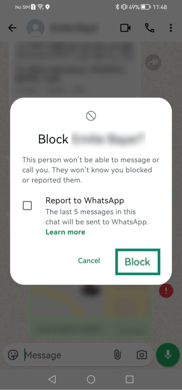 Screenshot showing the block button with the option to report a contact to WhatsApp.
