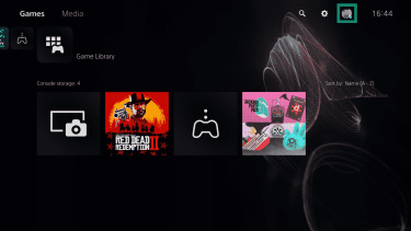 PlayStation 5 home screen. The profile icon is highlighted.