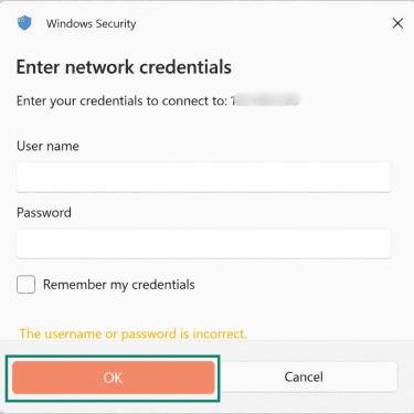 A Windows Security pop-up window, requesting login details in order to access file sharing on a Mac.